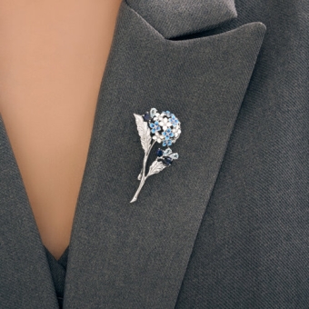 Brooch with Sky topazes, sapphires and enamel 